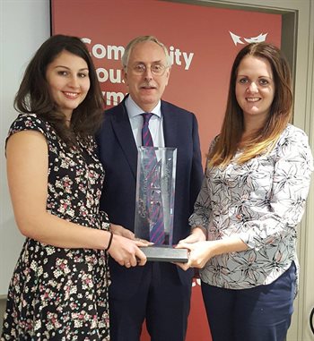 John Chown, Pat Chown’s husband, presents the award to Hazel Davies from Rooms4U (right) and Emma Rowlands from Newydd (left)