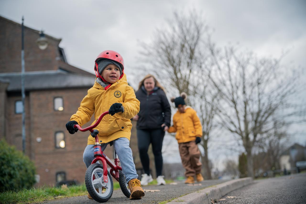 Young child cycling to school