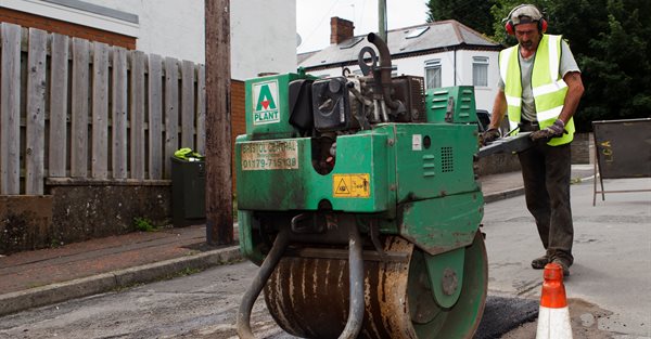 Pothole being filled