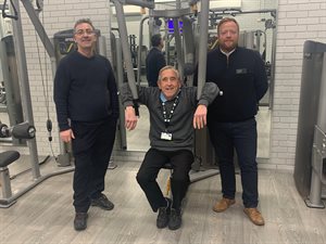 Cllr Eddie Williams, Cllr Gwyn John and Leisure Centre manager, Gavin McCarthy using the gym equipment