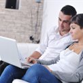 Couple using a laptop