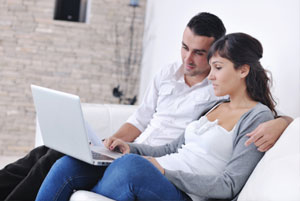 Couple using a laptop