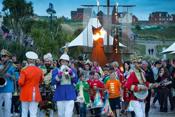 Musicians lead a parade