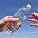 Passing a water bottle