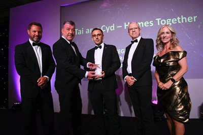 Andrew Freegard accepting award at CEW Awards 2025