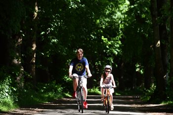 Cycling father and daughter