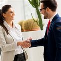Business man and woman shaking hands