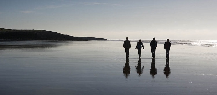 Walkers on the beach