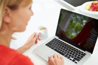 Woman-Using-Laptop-At-Home